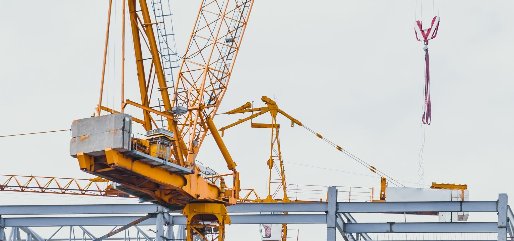 closeup crane hoist construction on white sky background.