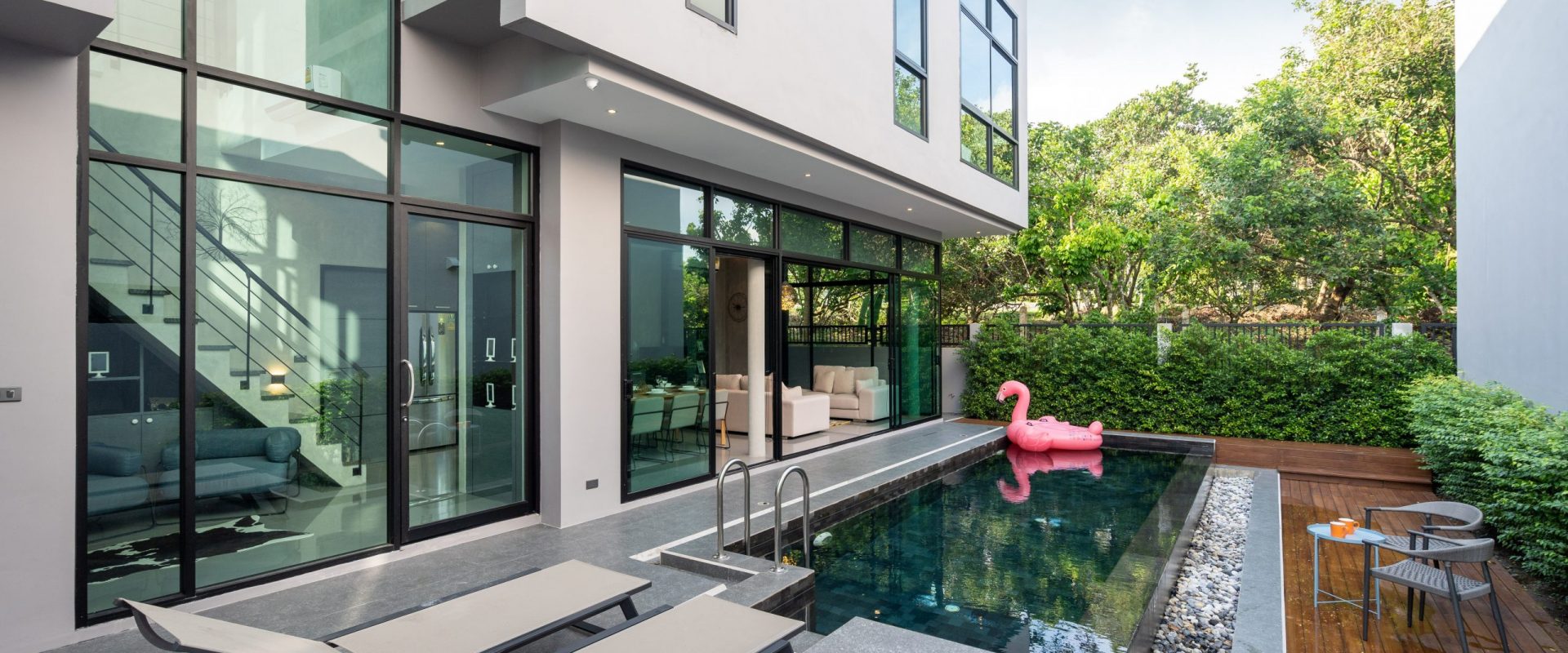 pool terrace and pink floating duck in infinity swimming pool