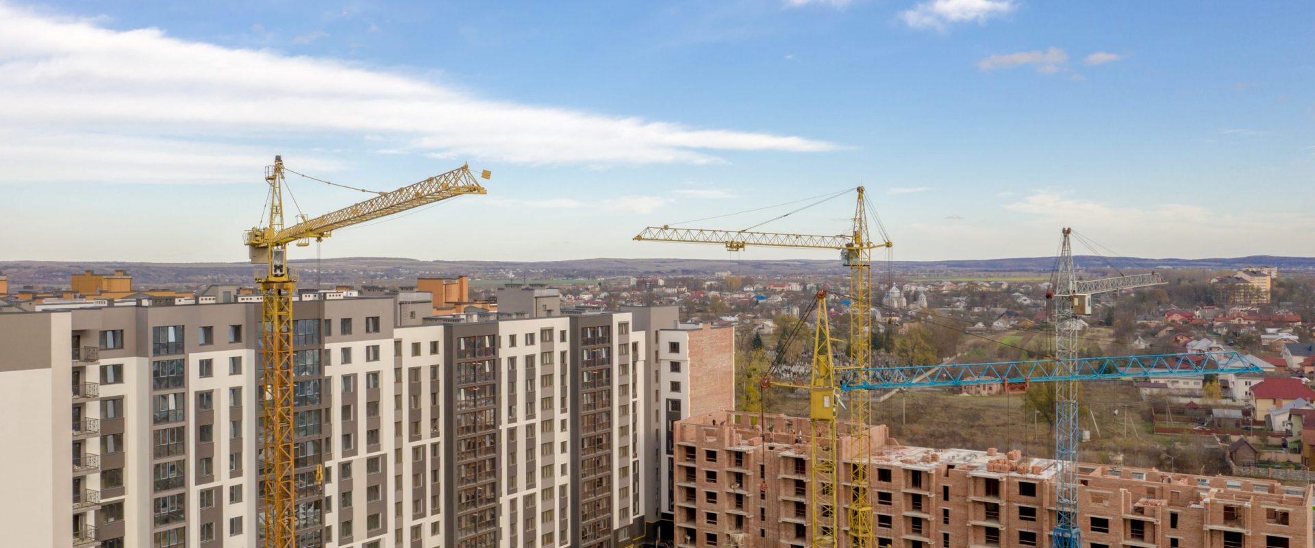 Kiev, Ukraine - June 10, 2019: Construction of a new multi-story residential complex. Cranes and building construction site. Modern apartment buildings is being building.